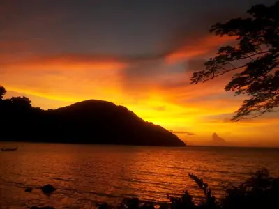a sunset over a large body of water at Phi Phi View Point Resort in Phi Phi Don
