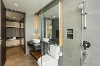a bathroom with a toilet and a sink and a shower at My Beach Resort Phuket, Panwa Beach in Panwa Beach