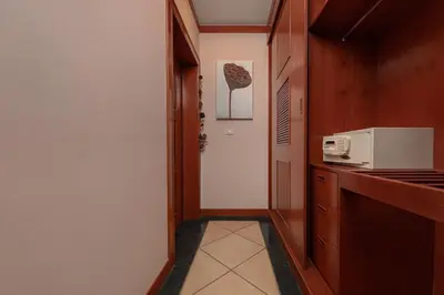 a small kitchen with a microwave and a counter at Villa Raas 3BR Private PoolNaiharn beach in Nai Harn Beach
