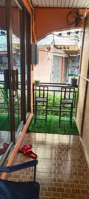 a view of a balcony with two benches in a room at Baan Asree homestayบ้านอัสรี in Ao Nang Beach