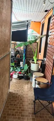 a hallway with potted plants in a room at Baan Asree homestayบ้านอัสรี in Ao Nang Beach