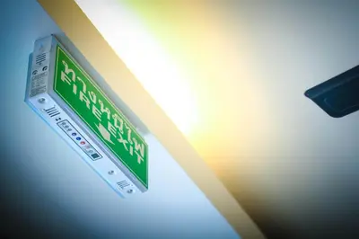 a green and white street sign on a wall at Vipa House Phuket - SHA Extra Plus in Chalong