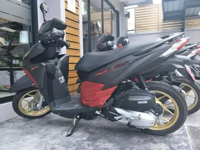 a group of motorcycles parked next to a building at Vipa House Phuket - SHA Extra Plus in Chalong