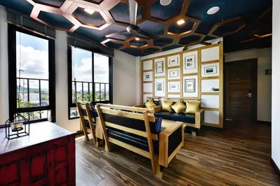 a living room with a couch and some windows at Casa Bella Phuket in Chalong