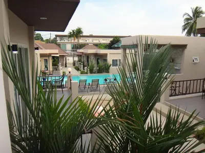 a view of a swimming pool from a house at Thuan Resort in Rawai Beach