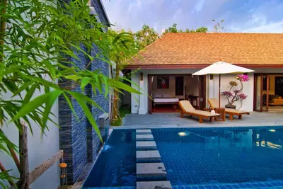 a villa with a swimming pool and a house at Villa Susu by Holiplanet in Rawai Beach