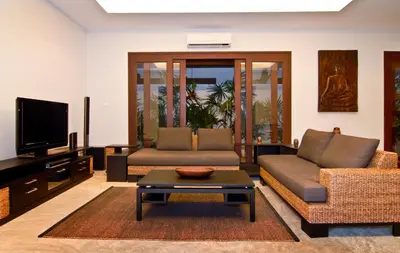 a living room with a couch and a tv at Villa Susu by Holiplanet in Rawai Beach