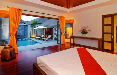 a bedroom with a bed and a pool at Villa Susu by Holiplanet in Rawai Beach