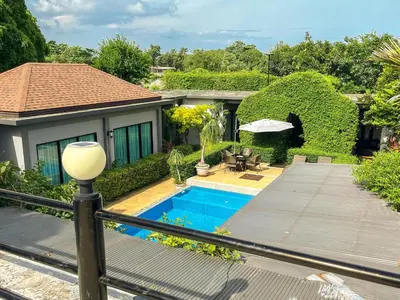 a house with a swimming pool in the backyard at BaanMee Phuket near Chalong Pier in Chalong