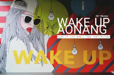 a poster for wake up anytime wake up wake up and smell the illustration at Wake Up Aonang Hotel in Ao Nang Beach