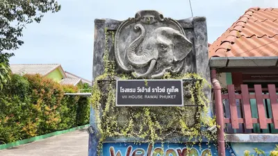 a sign with an elephant on the side of a building at Vii House Rawai Phuket in Rawai Beach