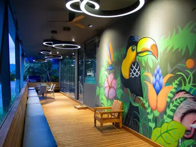 a hallway with a colorful mural on the wall at Glam Habitat - SHA Extra Plus in Kamala Beach