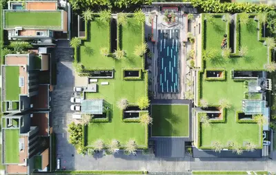 an overhead view of a city with houses and grass at Glam Habitat - SHA Extra Plus in Kamala Beach