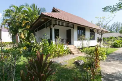 a house with a garden in front of it at Chaiyo Resort in Phuket Town