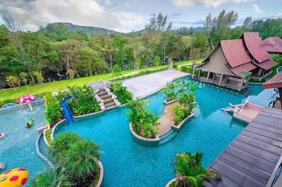 an aerial view of a water slide at a resort at Maikhao Palm Beach Resort - SHA Plus in Mai Khao Beach
