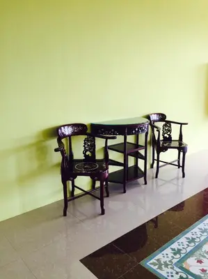 two chairs and a table and a table and chairs at Phuket Chinoinn-SHAPlus Certified in Phuket Town