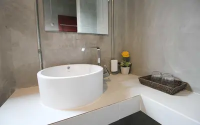 a bathroom with a white tub and a sink at Unique Loft Apartment in Kamala Beach