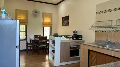 a kitchen with a sink and a counter top at Malinee Villa Phuket in Bang Tao Beach