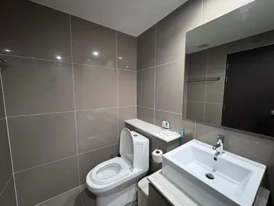 a bathroom with a white toilet and a sink at Centrio nearby Central Phuket in Phuket Town