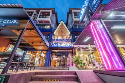 a store front with stairs in front of a building at Kokotel Krabi Ao Nang in Ao Nang Beach
