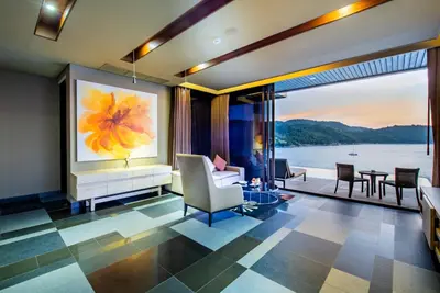 a living room with a view of the water at Impiana Private Villas Kata Noi in Kata Beach