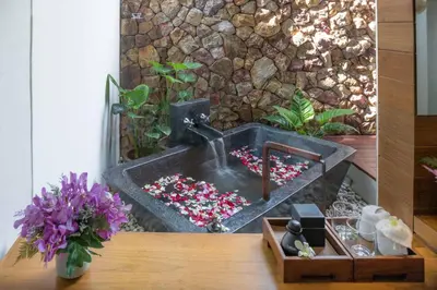 a bathroom sink filled with red and white sprinkles at The Tubkaak Krabi Boutique Resort in Tab Kaek Beach