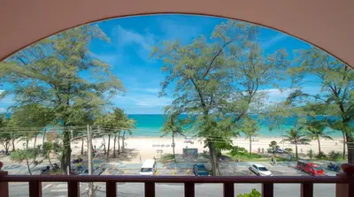 a view of the beach from a balcony at Phuket Graceland Resort and Spa in Patong Beach