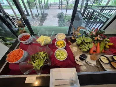 a table with many different types of vegetables on it at Ramada by Wyndham Aonang Krabi in Ao Nang Beach