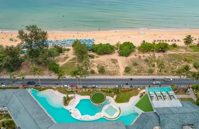 an aerial view of a resort with a beach at Thavorn Palm Beach Resort Phuket in Karon Beach