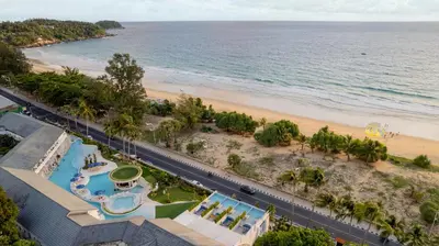an aerial view of the beach and the ocean at Thavorn Palm Beach Resort Phuket in Karon Beach