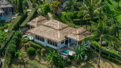 an aerial view of a house with palm trees at Paradise Koh Yao in Ko Yao Noi