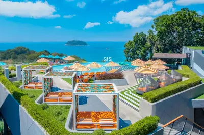 a view of the pool at the resort with umbrellas at The SIS Kata Resort - Adult Only in Kata Beach