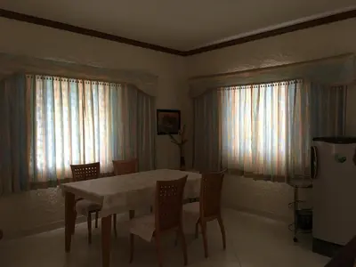 a dining room with a table and chairs at Peaceful homestay in Rawai Beach