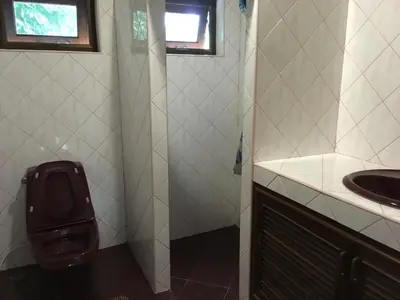 a bathroom with a toilet and a sink at Peaceful homestay in Rawai Beach