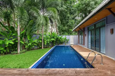 a swimming pool in the backyard of a house at VILLA FLORES 3BR Private Pool 10 min to Nai Harn in Rawai Beach