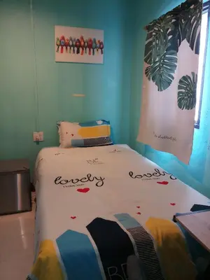 a bedroom with a bed with hearts on it at Kata S. T. House in Kata Beach
