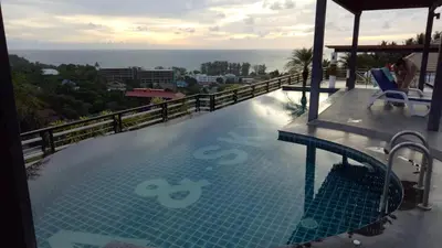 a swimming pool on top of a building at Sea and Sky Condominium Room #406 in Karon Beach
