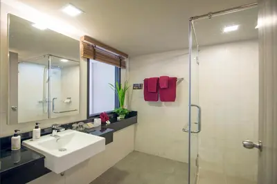 a bathroom with a sink and a shower at Krabi La Playa Resort in Ao Nang Beach