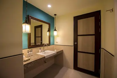 a bathroom with a sink and a mirror at Krabi La Playa Resort in Ao Nang Beach