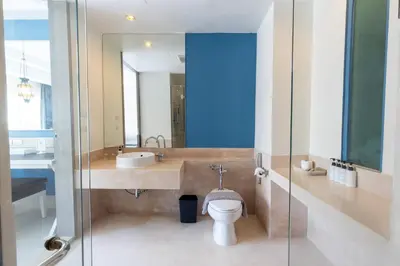 a bathroom with a sink and a toilet at Navinda Krabi in Ao Nang Beach