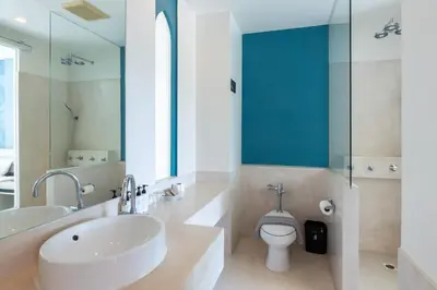 a bathroom with a sink and a toilet at Navinda Krabi in Ao Nang Beach