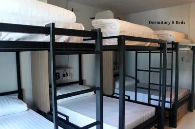 a group of bunk beds in a room at Phuket Marine Poshtel - SHA Plus in Chalong