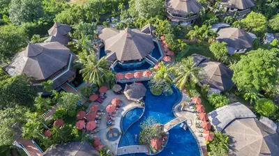 an aerial view of a resort with a swimming pool at Mangosteen Ayurveda & Wellness Resort - SHA Plus in Rawai Beach