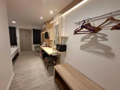 a room with a desk and a bed and a room with a room at Phi Phi Arboreal Resort in Phi Phi Don
