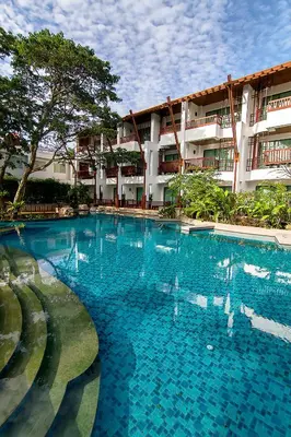 a large swimming pool in front of a building at The Elements Krabi Resort - SHA Plus in Klong Muang Beach