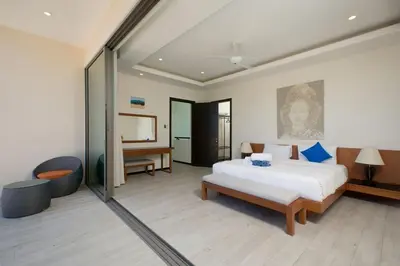 a large bedroom with a bed and a television at VILLA BAWAL 4BR Private pool villa in Rawai Beach