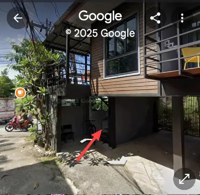 a building with a red arrow pointing to a house at The Endless Bangtao Residence 1987 in Bang Tao Beach