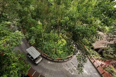 an overhead view of a park with trees at Paresa Resort Phuket in Kamala Beach