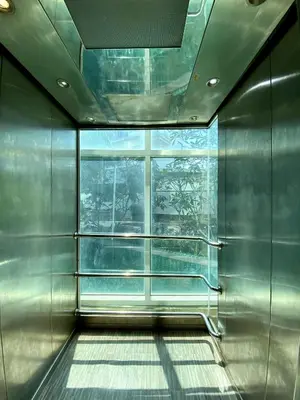 a room with a window and a metal wall at APK Resort Patong in Patong Beach