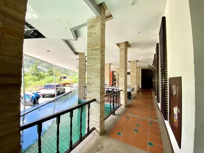 a view of a swimming pool from the balcony of a house at APK Resort Patong in Patong Beach